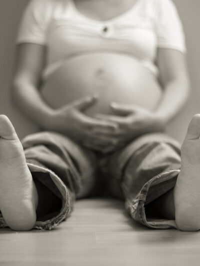 pregnant woman sitting on floor