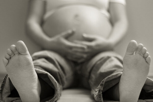 pregnant woman sitting on floor