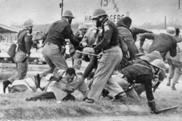 John Lewis being beaten by state troopers during Selma march
