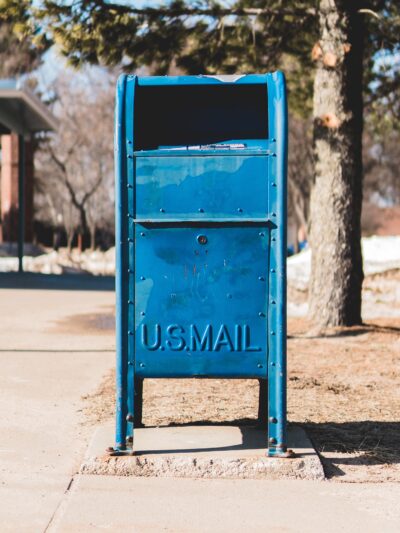 A picture of a blue mailbox. Photo taken by Alex Perz.
