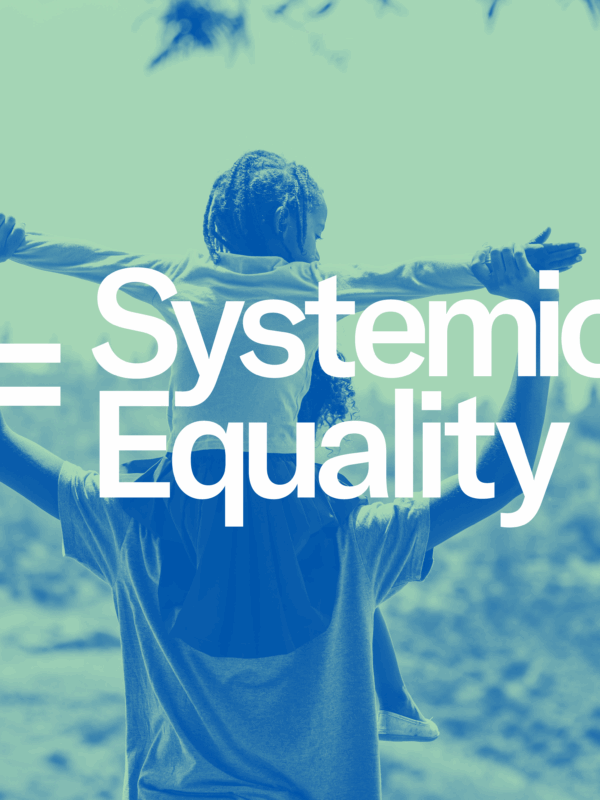 The text 'Systemic Equality' overlaid on the image of a child on the shoulders of an adult.