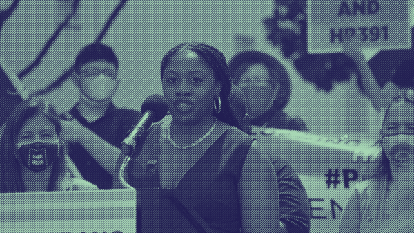 A photo of Executive Director JaTaune Bosby at a rally. Taken by Jill Friedman.