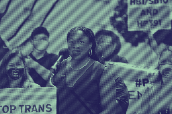 A photo of Executive Director JaTaune Bosby at a rally. Taken by Jill Friedman.