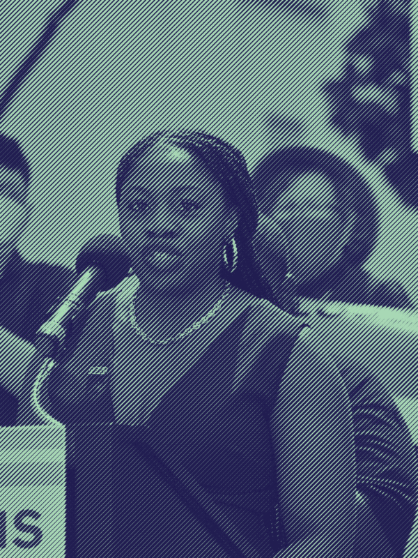 A photo of Executive Director JaTaune Bosby at a rally. Taken by Jill Friedman.