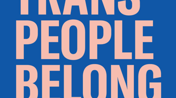 pink text on blue background "trans people belong"