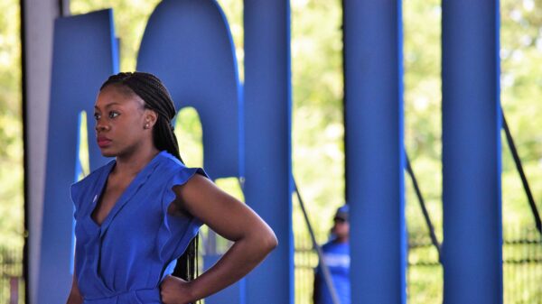 JaTaune stands in front of ACLU letters