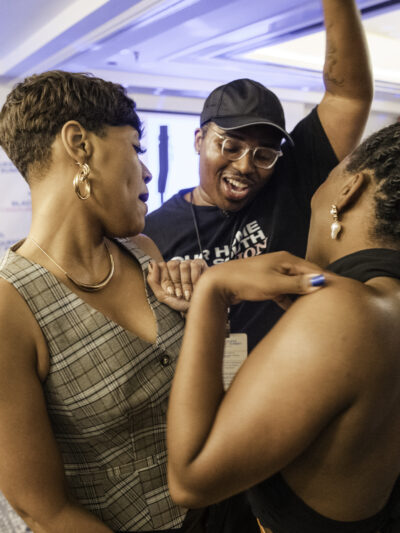 three people dancing inside