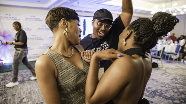 three people dancing inside