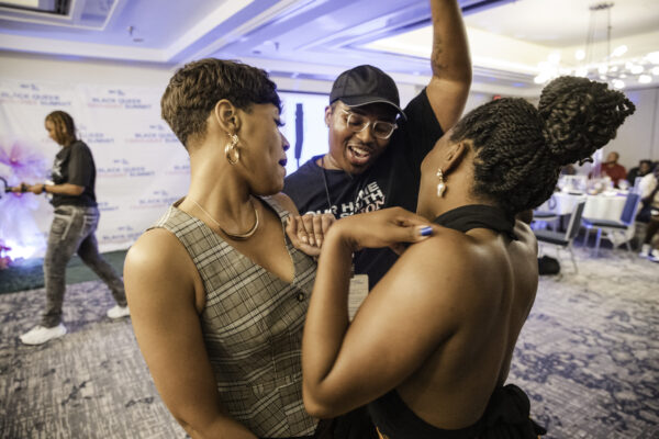 three people dancing inside