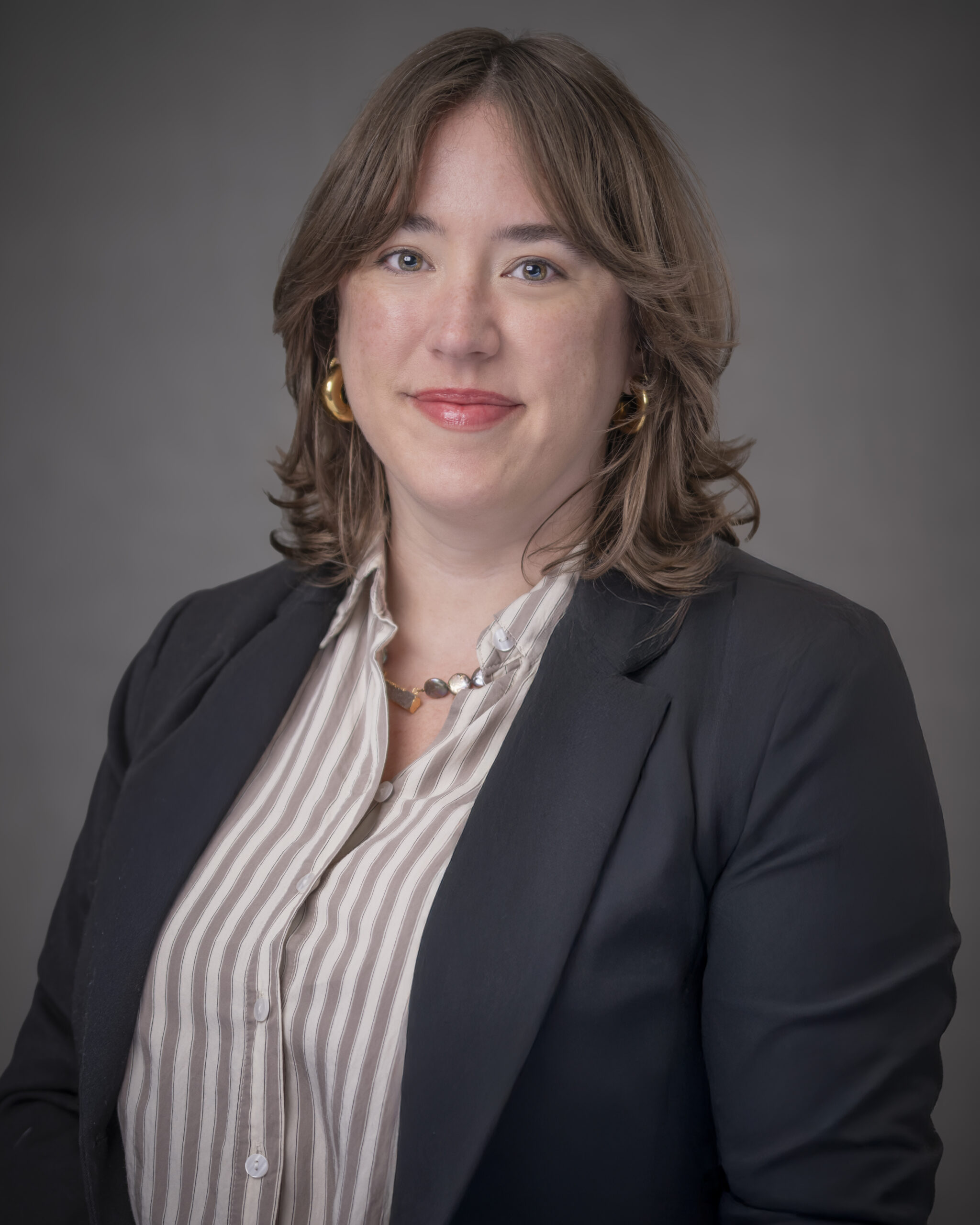 headshot of woman in suit