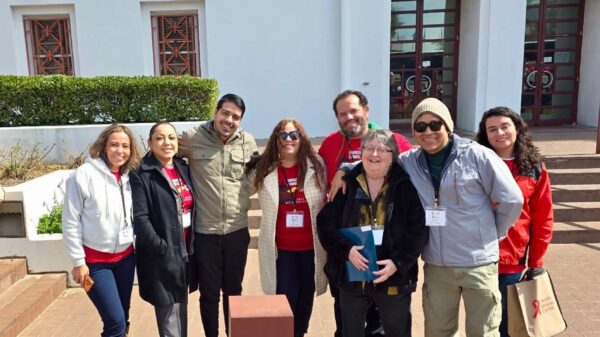 group of volunteers standing in front of the state house