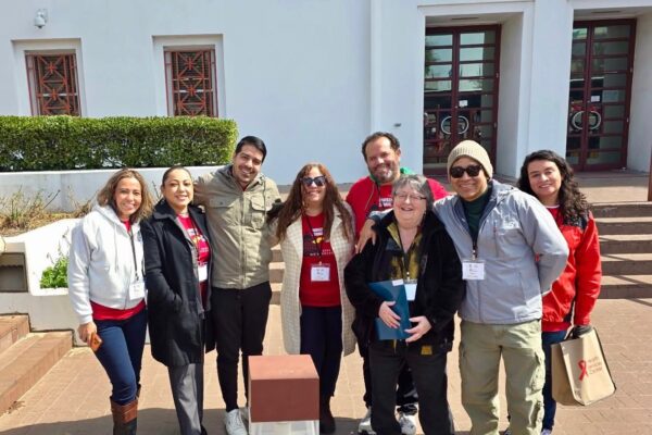 group of volunteers standing in front of the state house