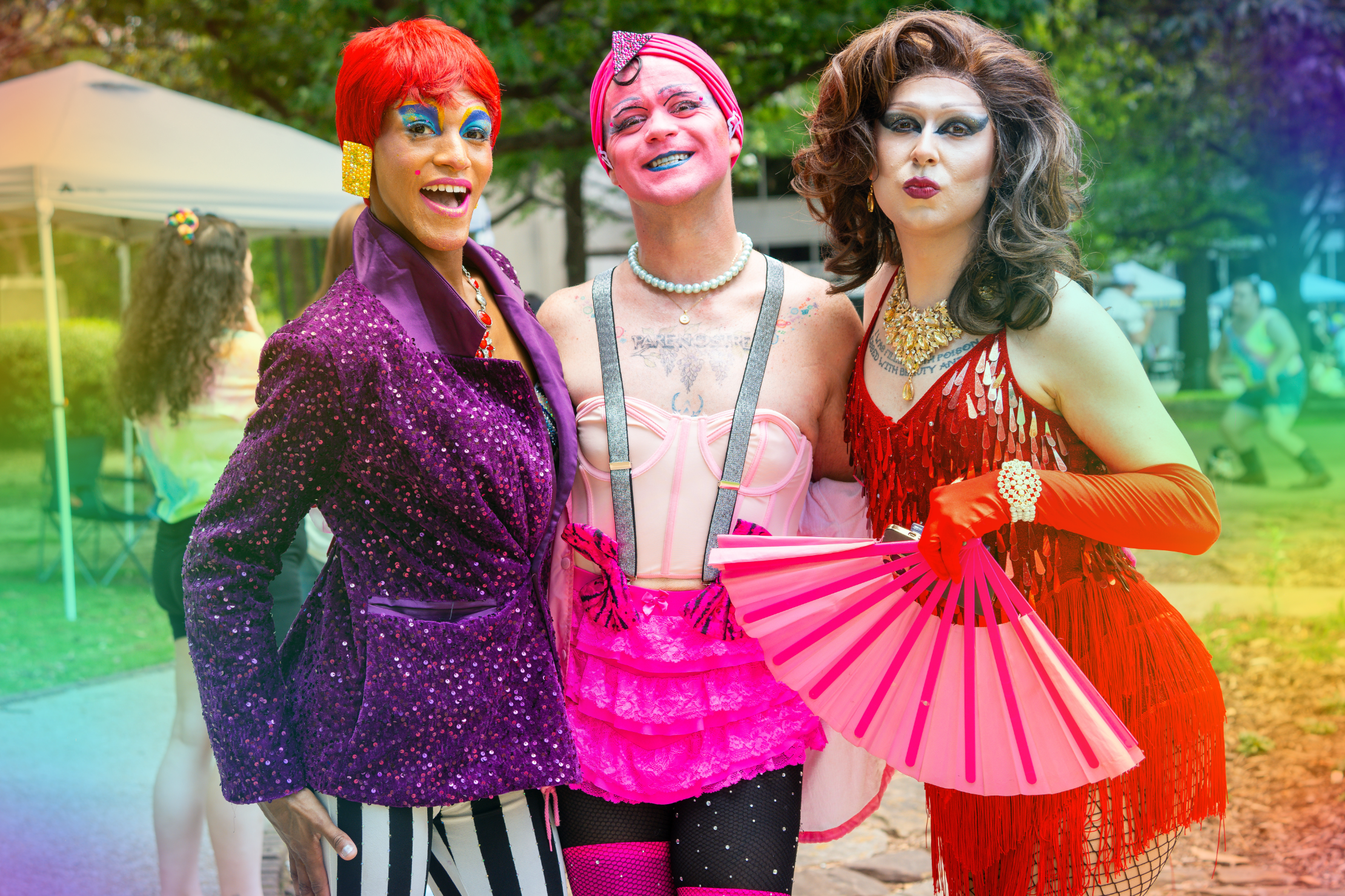 three drag queens posing for photo