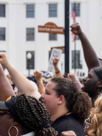 crowd with fists raised