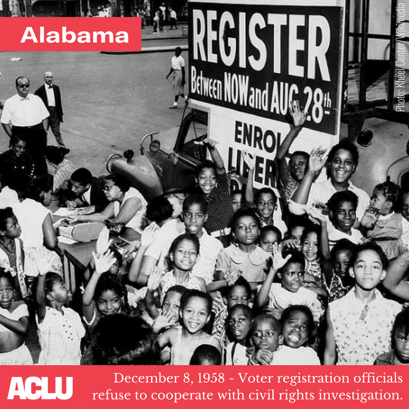 black and white archival photo of black people at a voter registration event