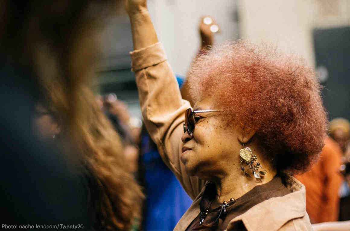 Black woman with fist raised