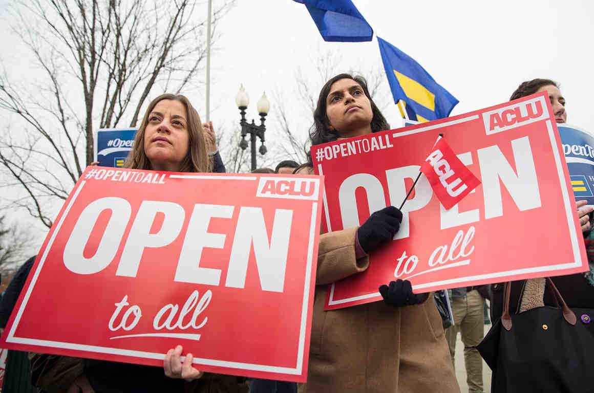 protestors with open to all signs