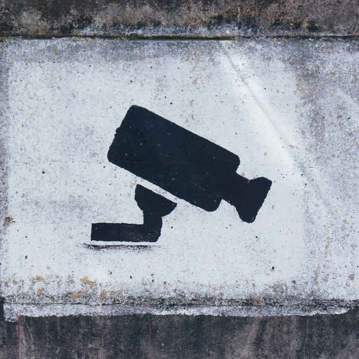 A painting on a wall warning visitors about video surveillance