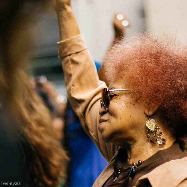 Black woman with fist raised