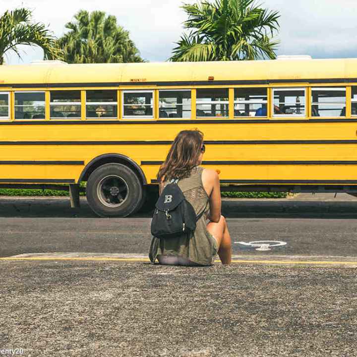 student waiting for the school bus
